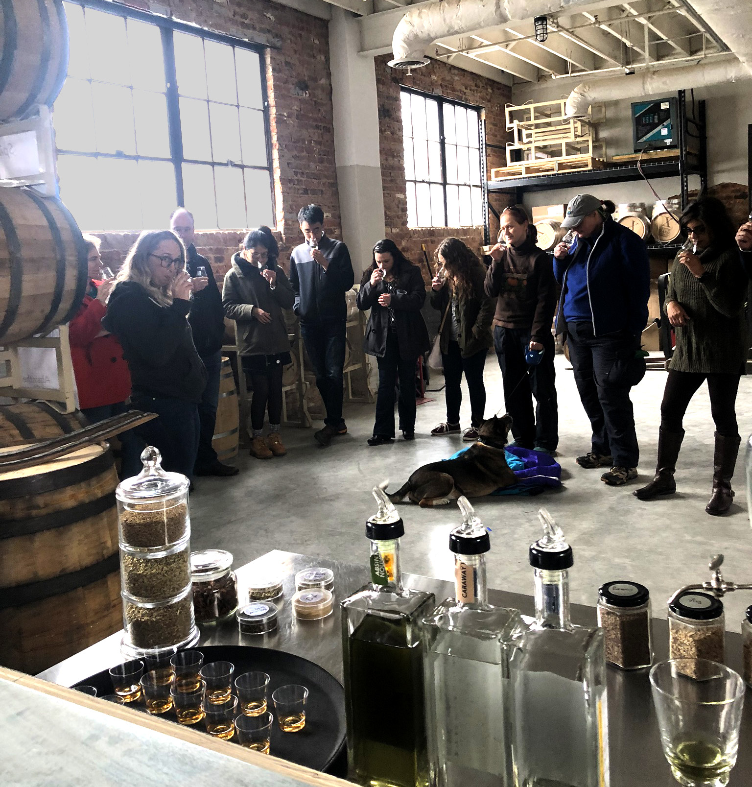 Tour group learning how to nose and taste spirits at Tenth Ward Distilling Company